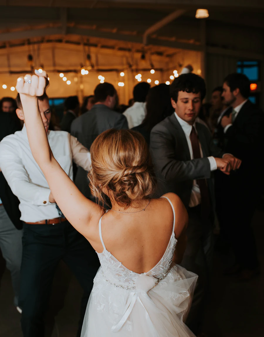 A bride dancing with guests