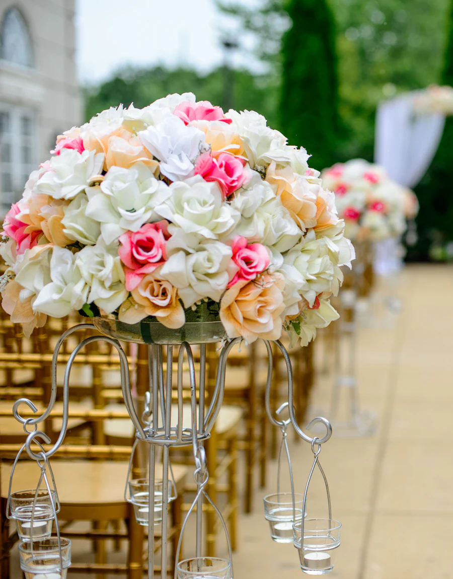 An aisle lined with pink and white flowers