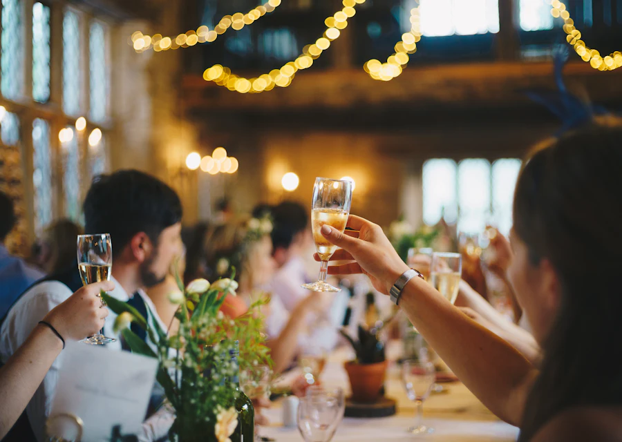 Guests raising glasses in a toast